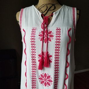 White sleeveless embroidered dress with tassle tie